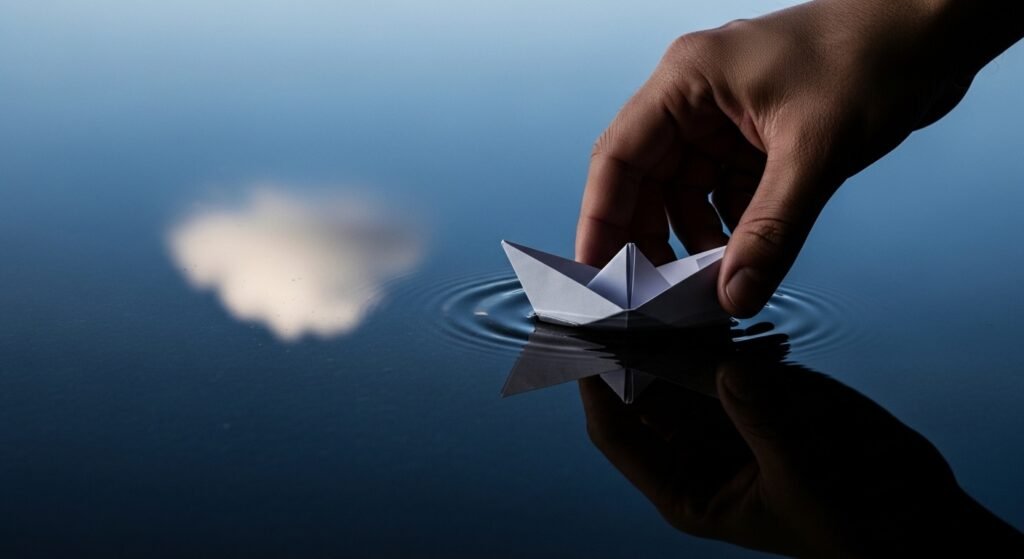  hand holding a paper boat representing financial stability and calm investing